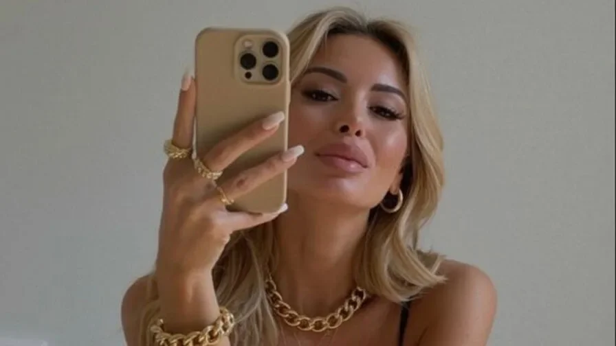Adult cam model using a phone camera before a cam to cam privacy check